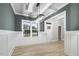 Dining room with green walls, white wainscoting, and chandelier at 45 S Harper Faith Way, Benson, NC 27504
