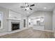 Spacious living area with hardwood floors, fireplace and kitchen views at 45 S Harper Faith Way, Benson, NC 27504