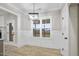 Light-filled dining area with hardwood floors and wainscoting at 45 S Harper Faith Way, Benson, NC 27504