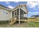 New home with a spacious screened porch and wooden steps at 45 S Harper Faith Way, Benson, NC 27504
