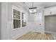 Bright breakfast nook with wainscoting and hardwood floors at 45 S Harper Faith Way, Benson, NC 27504