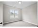 Bright bedroom with carpet flooring and a large window at 45 S Harper Faith Way, Benson, NC 27504