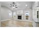 Open living room with vaulted ceiling, fireplace, and hardwood floors at 45 S Harper Faith Way, Benson, NC 27504
