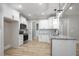 Modern kitchen with white cabinets, granite countertops, and stainless steel appliances at 45 S Harper Faith Way, Benson, NC 27504
