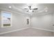 Bright bedroom featuring carpet flooring and large windows at 45 S Harper Faith Way, Benson, NC 27504
