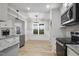 Open concept kitchen with island and stainless steel appliances at 45 S Harper Faith Way, Benson, NC 27504