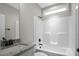 Clean bathroom with granite vanity, tub shower combo, and neutral palette at 45 S Harper Faith Way, Benson, NC 27504