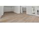 Finished basement with hardwood floors and doors leading to backyard at 488 Colvard Farms Rd, Durham, NC 27713