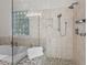 Elegant bathroom with a glass-enclosed shower and pebble tile flooring at 488 Colvard Farms Rd, Durham, NC 27713