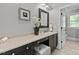 Bathroom with dark vanity and a separate toilet area at 488 Colvard Farms Rd, Durham, NC 27713