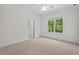 Bright bedroom with ceiling fan and large window at 488 Colvard Farms Rd, Durham, NC 27713