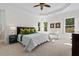 Main bedroom with plush carpet, large windows, and ample closet space at 488 Colvard Farms Rd, Durham, NC 27713