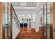 Bright entryway with hardwood floors and a grand staircase at 488 Colvard Farms Rd, Durham, NC 27713