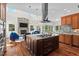 Gourmet kitchen boasts large island, stainless steel appliances, and custom cabinetry at 488 Colvard Farms Rd, Durham, NC 27713