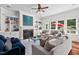 Spacious living room with fireplace, built-in shelving, and ample natural light at 488 Colvard Farms Rd, Durham, NC 27713