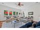 Relaxing living room with plush seating, a coffee table and large windows offering backyard access at 488 Colvard Farms Rd, Durham, NC 27713