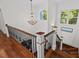 Grand staircase with ornate railing and hardwood floors at 488 Colvard Farms Rd, Durham, NC 27713