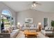 Virtually staged living room with gray couches and a coffee table at 6849 Coventry Ridge Rd, Raleigh, NC 27616