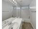 Clean bathroom with shower/tub combo, single sink vanity, and tile floor at 6849 Coventry Ridge Rd, Raleigh, NC 27616