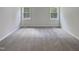 Bright bedroom with neutral walls and carpet flooring at 6849 Coventry Ridge Rd, Raleigh, NC 27616