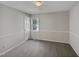 Bright bedroom with neutral walls, carpet flooring, and a window at 6849 Coventry Ridge Rd, Raleigh, NC 27616