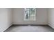 Simple bedroom with grey carpet and window at 6849 Coventry Ridge Rd, Raleigh, NC 27616