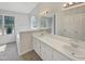 Bathroom with double vanity, garden tub, and separate shower at 6849 Coventry Ridge Rd, Raleigh, NC 27616