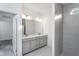 Modern bathroom with double vanity, gray cabinets, and large walk-in shower at 1724 Red Elm Lane, Homesite 76, Fuquay Varina, NC 27526
