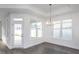 Bright dining room with hardwood floors and chandelier at 1724 Red Elm Lane, Homesite 76, Fuquay Varina, NC 27526