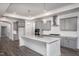Modern kitchen with gray cabinets and island at 1724 Red Elm Lane, Homesite 76, Fuquay Varina, NC 27526