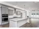 Modern kitchen with gray cabinets and island at 1724 Red Elm Lane, Homesite 76, Fuquay Varina, NC 27526