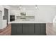 Large kitchen island with dark gray cabinets and white countertops at 2209 Abbeyhill Dr # 118, Raleigh, NC 27610