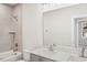 Contemporary bathroom with dual vanity and geometric tile at 4738 Cypress Tree Ln, Raleigh, NC 27612