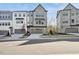 Three-story townhouses with gray and white siding at 4738 Cypress Tree Ln, Raleigh, NC 27612