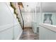 Hallway with a view of the staircase and a door at 3152 87 Hwy, Graham, NC 27253