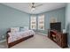 Bedroom with daybed, TV, and plenty of natural light at 495 Bramble Ln, Clayton, NC 27527