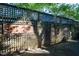 Rustic wooden fence with decorative metal artwork at 107 Silo Dr, Chapel Hill, NC 27514