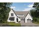 Two-story house with a gray roof, white brick, and a two-car garage at 414 Englewood Dr, Chapel Hill, NC 27514