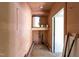 Small basement storage area with shelving and water heater at 1016 Walnut St, Burlington, NC 27217