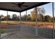 Covered porch with ceiling fan and view of a field and trees at 4303 Bragg Farm Ln, Franklinton, NC 27525