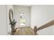 Bright and airy entryway with wood floors and modern console table at 708 Portia Way, Homesite 13, Morrisville, NC 27560