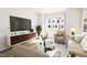 Spacious living room boasts ample seating and large windows with natural light at 712 Portia Way, Homesite 11, Morrisville, NC 27560