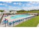 Community pool with lounge chairs and cabana at 9228 Leaning Post Rd # 445, Wake Forest, NC 27587