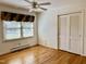 Bright bedroom with hardwood floors and large closet at 1016 Driftwood Dr, Siler City, NC 27344
