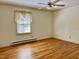 Bright bedroom featuring hardwood floors and a ceiling fan at 1016 Driftwood Dr, Siler City, NC 27344