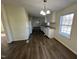 Dining area with laminate flooring and view into kitchen at 399 Old Halifax Rd, Louisburg, NC 27549