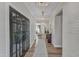 Elegant entryway with hardwood floors, double French doors, and light fixtures at 616 Silver Comet Dr, Knightdale, NC 27545