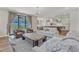Living room with open concept to kitchen and access to patio at 616 Silver Comet Dr, Knightdale, NC 27545