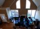 Vaulted ceiling living room with large windows and fireplace at 4874 Thom Rd, Mebane, NC 27302