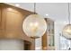 Close-up of a modern, spherical glass kitchen light fixture at 909 N Gregson St, Durham, NC 27701